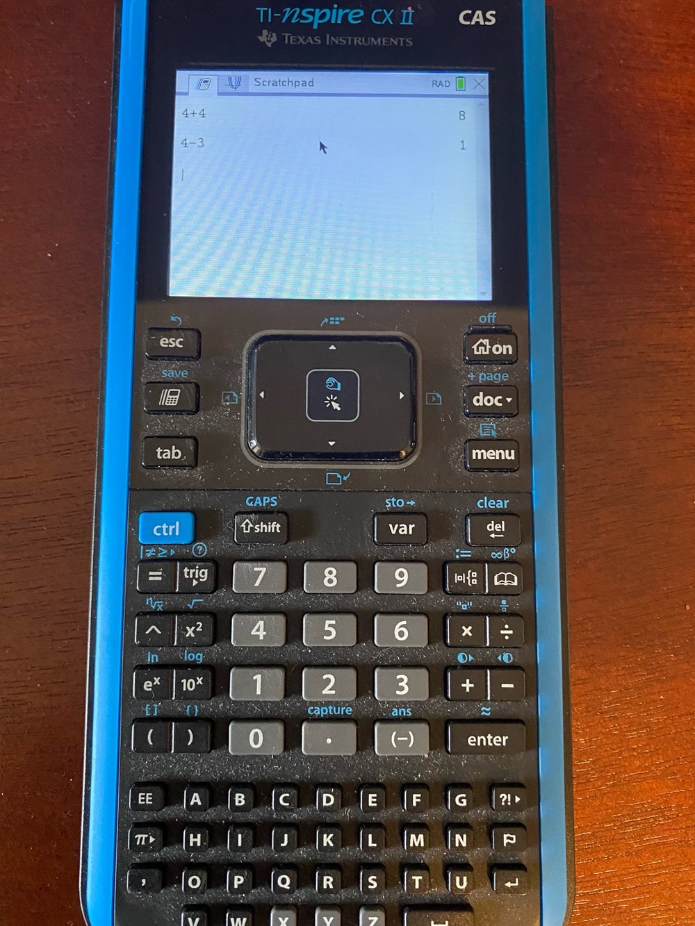 Texas Instruments Graphing Calculator with Blue Accents and Black Body - Picture 4 of 8